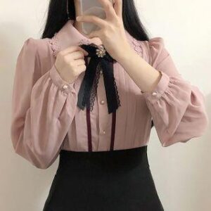 blush-pink sheer puff-sleeve blouse with black ribbon bow